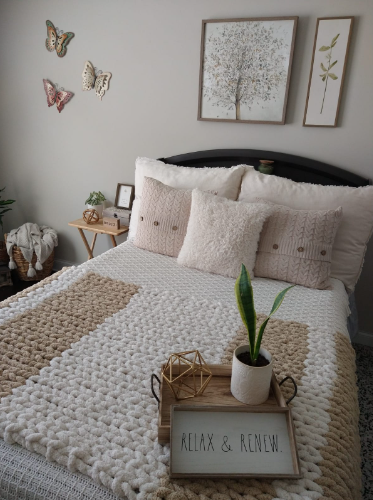 Cream Fuzzy Throw Pillow with chunky blanket in nuetrals