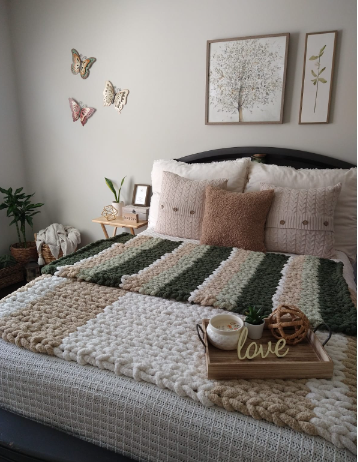 light brown throw pillow with chunky blanket