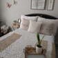 Cream Fuzzy Throw Pillow with chunky blanket in nuetrals